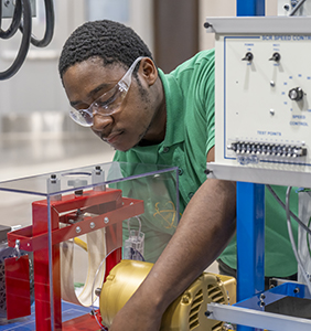 A student works on equipment as part of the FAME program.